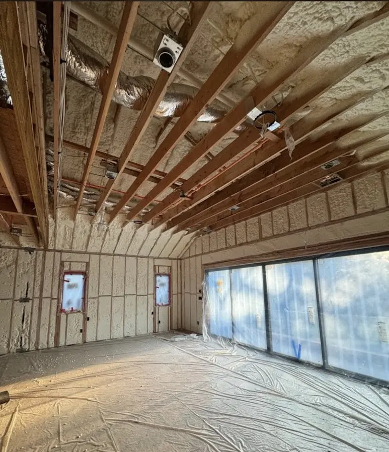Interior walls and ceiling insulated with spray foam during new construction in Mililani Town
